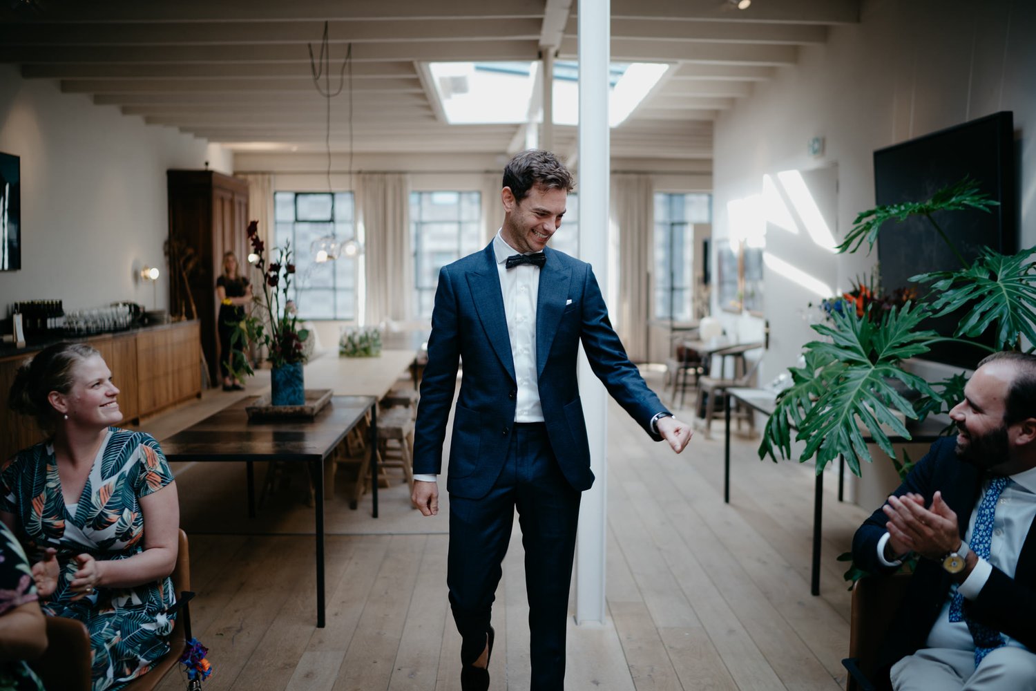 wedding photo of groom walking down the isle 