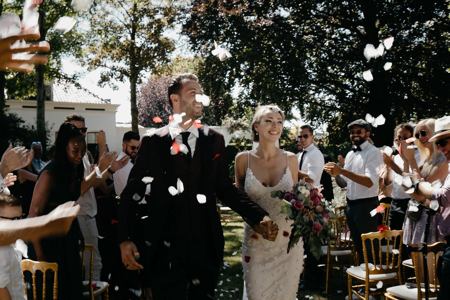 rotterdam garden wedding photography couple just married with rose petals