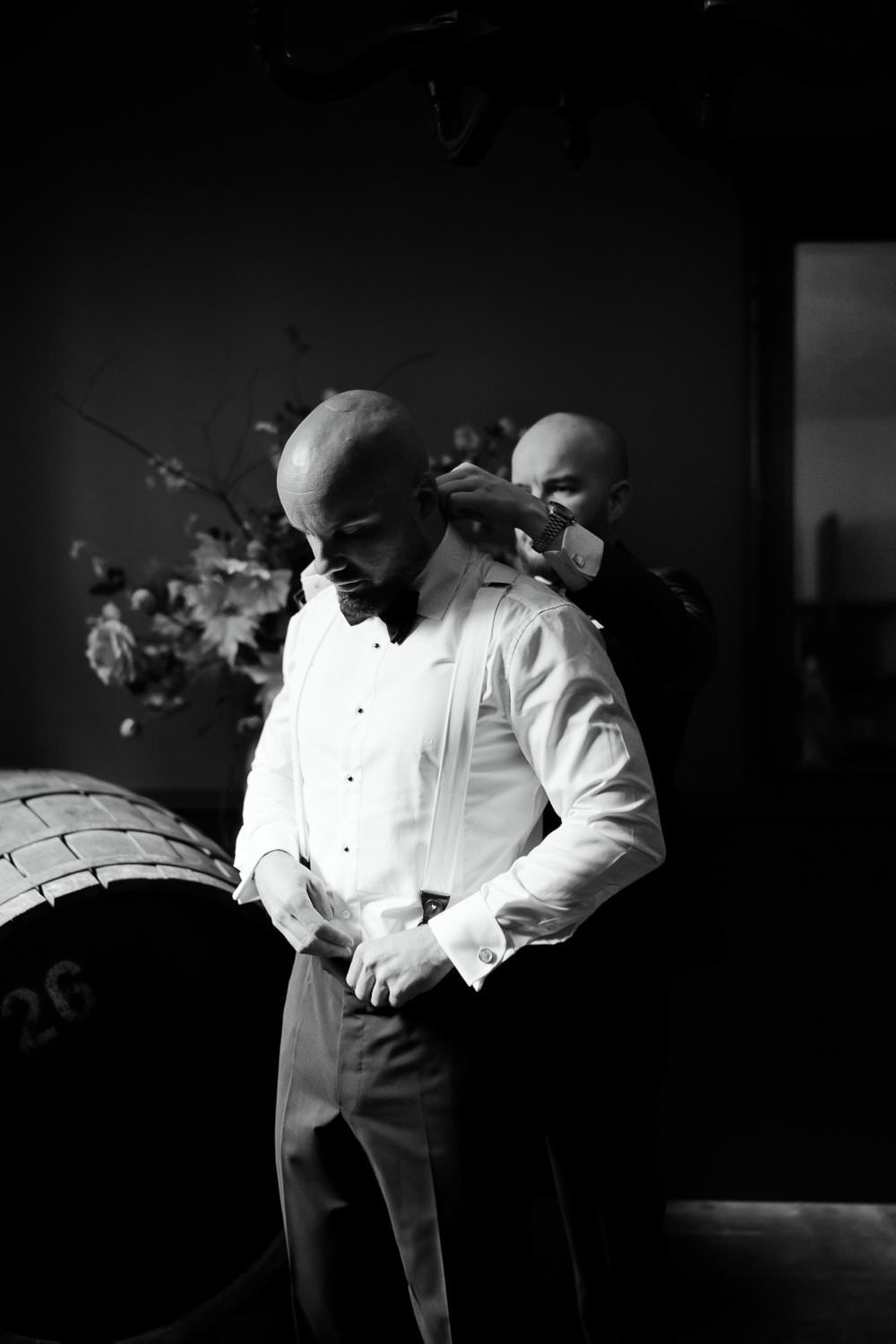 Michelle Jethro-036-2 - best man helping groom getting ready on wedding day.jpg