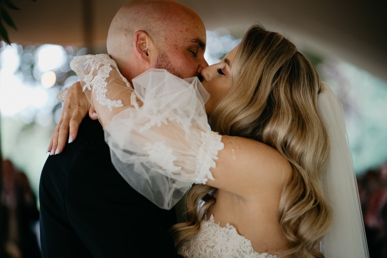 Michelle Jethro-129 - groom and bride kissing at wedding reception.jpg