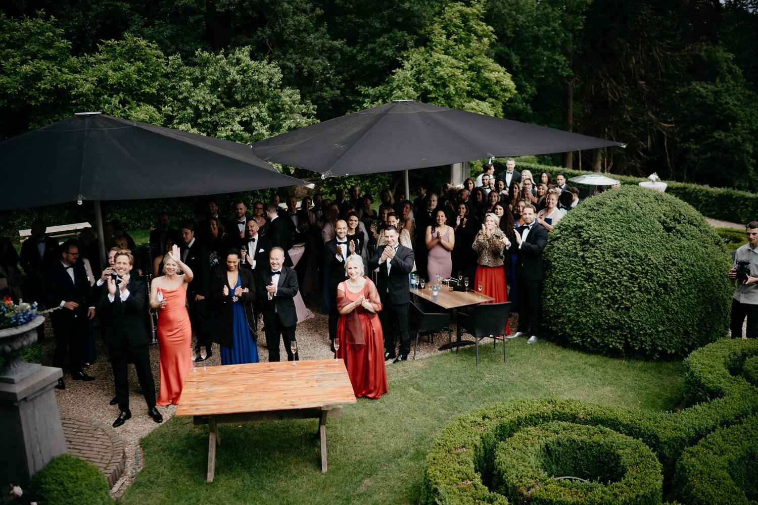 Michelle Jethro-149 - elegant guests applauding at outdoor wedding reception in amsterdam.jpg