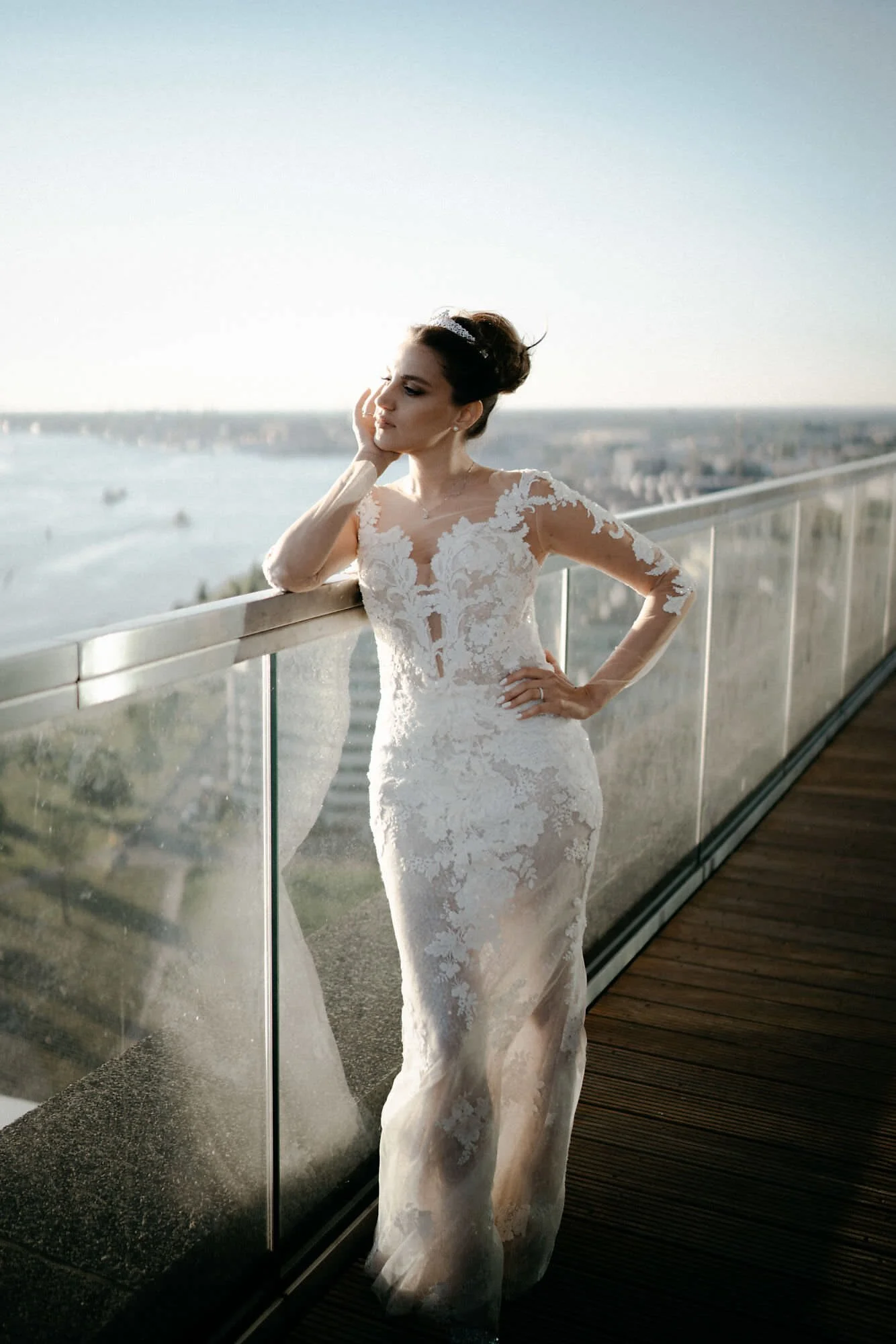 Kareline_Amir_313 - Bride posing on a terrace overlooking amsterdam from a'dam tower during a wedding photoshoot.jpg