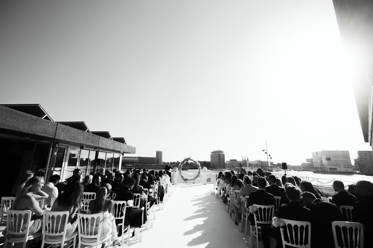 Kareline_Amir_070_2 - Guests attending outdoor wedding ceremony at a'dam tower in amsterdam.jpg