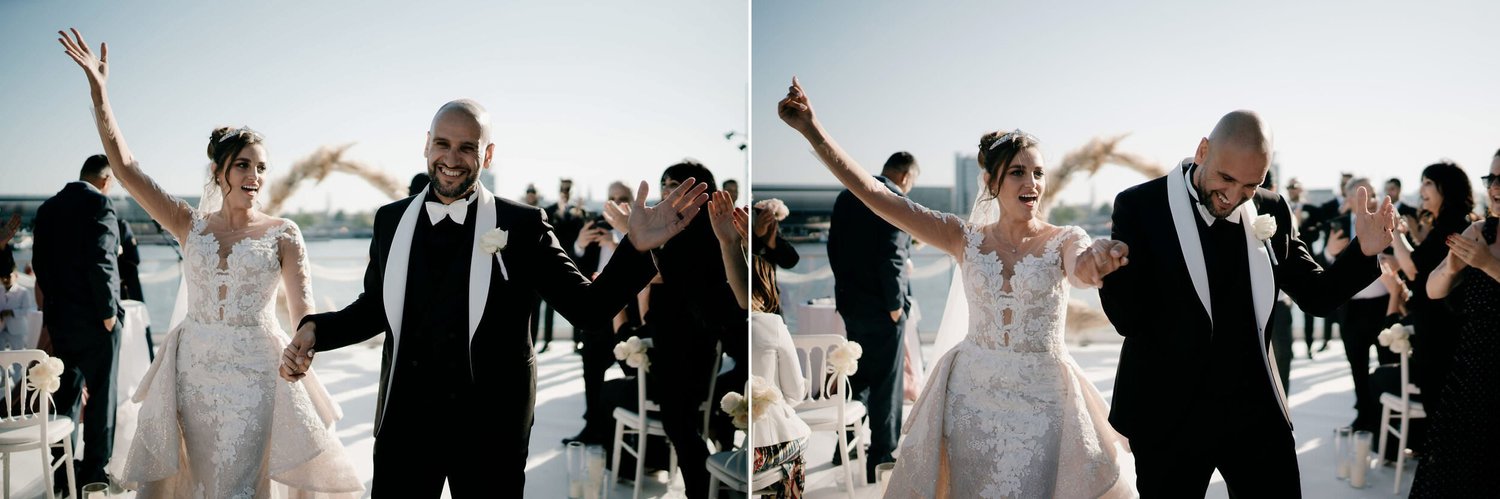Kareline_Amir_169copy - Bride and groom celebrating with guests at rooftop wedding reception in amsterdam.jpg