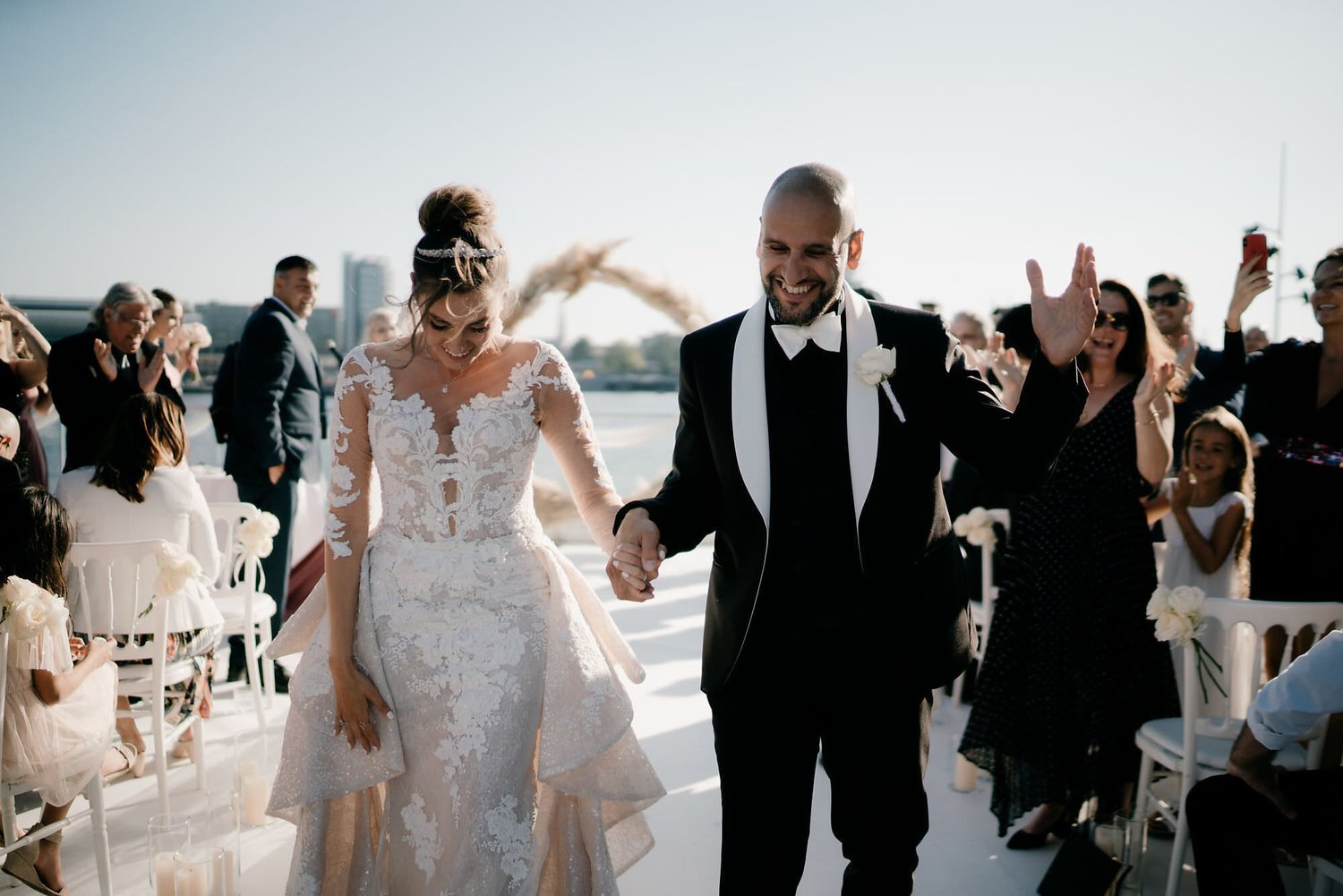 Kareline_Amir_173 - Happy newlyweds leaving ceremony with guests applauding in amsterdam.jpg