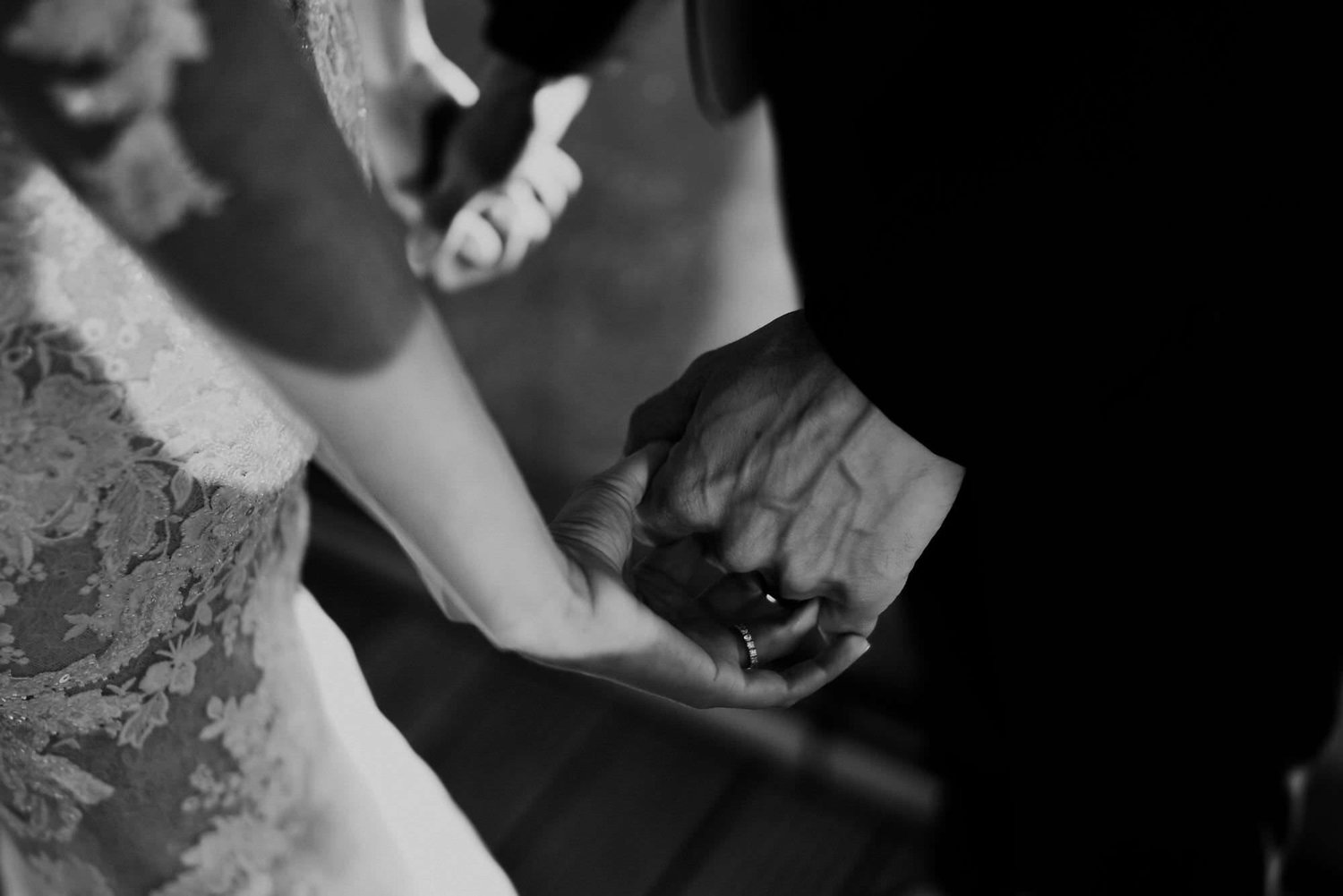 Kareline_Amir_334_2 - Groom holding bride's hand showing wedding ring in amsterdam.jpg