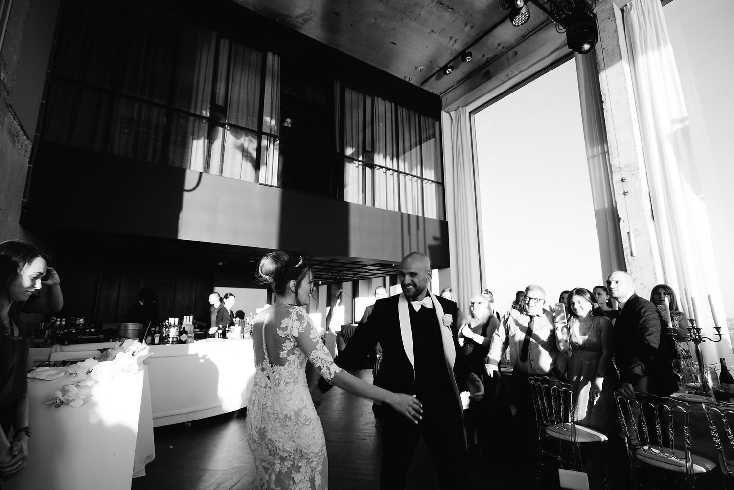 Kareline_Amir_338_2 - Bride and groom dancing at wedding reception in modern loft in a'dam tower, amsterdam.jpg