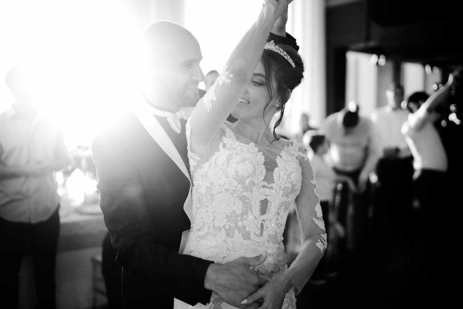 Kareline_Amir_342_2 - Groom holding bride's waist while dancing at wedding reception.jpg
