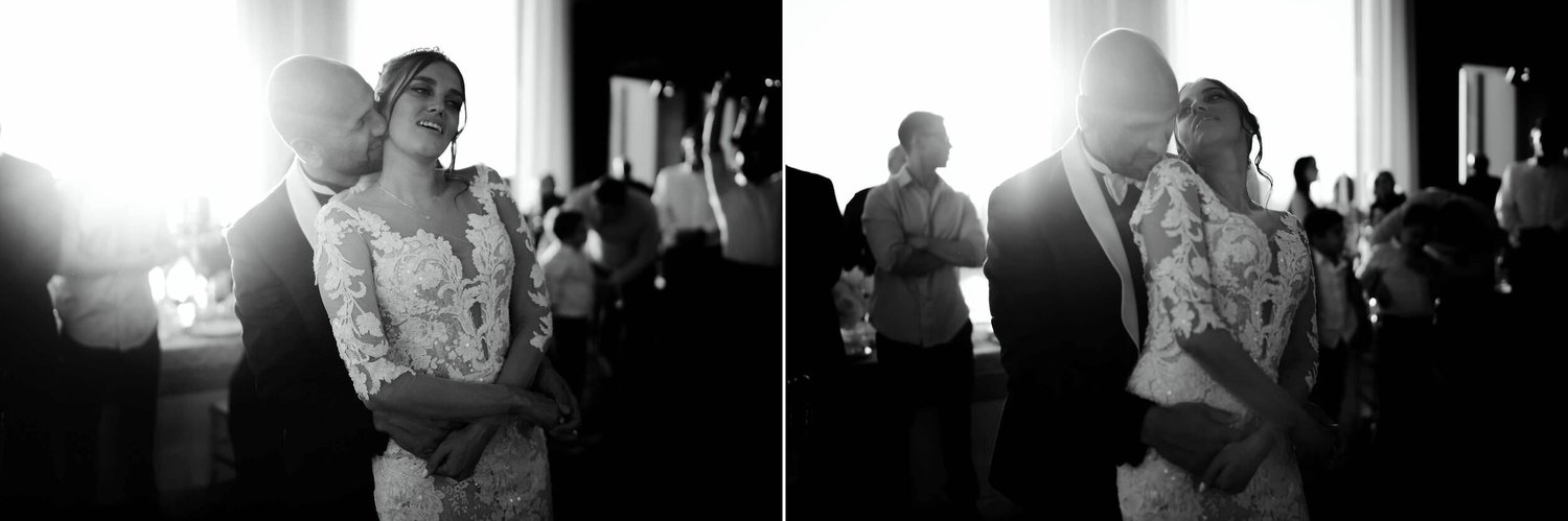 Kareline_Amir_344_2copy - Groom embracing bride during first dance at wedding reception in amsterdam's a'dam tower.jpg