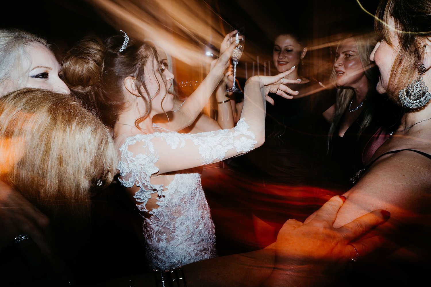 Kareline_Amir_474 - Bride raising glass celebrating with guests at wedding reception party.jpg